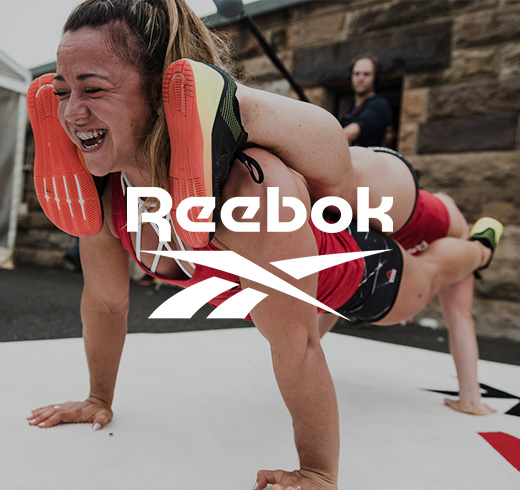 reebok logo on an image of a woman doing a plank on another woman