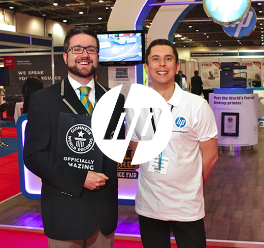 HP logo in front of adjudicator and man in HP uniform