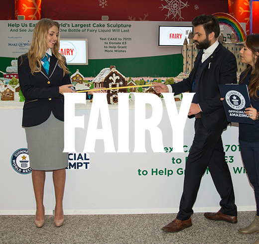 Fairy logo next to adjudicator with measuring tape next to man 